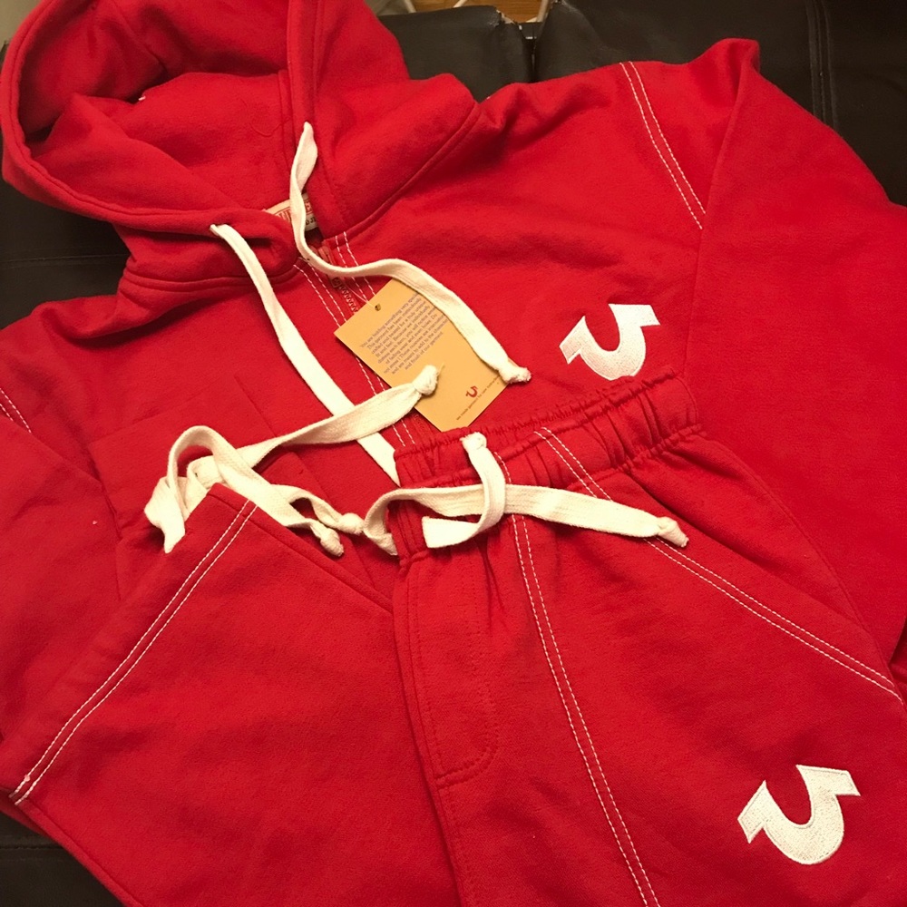 Red suit with white logo
